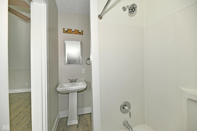 631 Prospect St, Indianapolis, IN 46203 - bathroom featuring wood finished floors and shower / bath combination