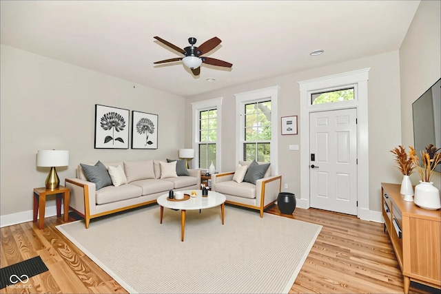 631 Prospect St, Indianapolis, IN 46203 - living room with light wood-type flooring, a ceiling fan, and recessed lighting
