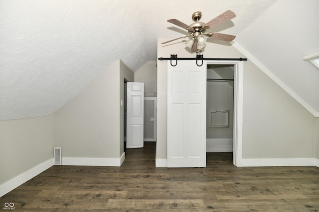 631 Prospect St, Indianapolis, IN 46203 - bonus room with vaulted ceiling, ceiling fan, a textured ceiling, and dark wood finished floors