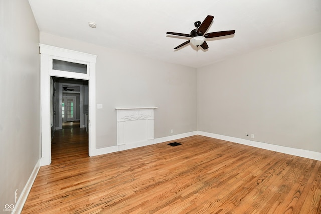 631 Prospect St, Indianapolis, IN 46203 - spare room with light wood-type flooring, a ceiling fan, and a smoke detector