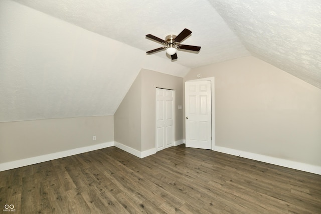 631 Prospect St, Indianapolis, IN 46203 - bonus room with a ceiling fan, vaulted ceiling, wood finished floors, and a textured ceiling