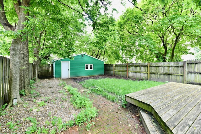 631 Prospect St, Indianapolis, IN 46203 - fenced backyard featuring an outbuilding and a deck