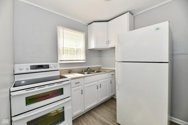 2966 N Olney St, Indianapolis, IN 46218 - kitchen featuring white appliances, a sink, white cabinets, light wood-type flooring, and light countertops