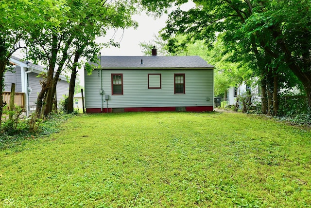 2966 N Olney St, Indianapolis, IN 46218 - back of property with a lawn and crawl space