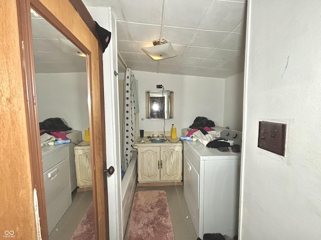 clothes washing area featuring cabinet space