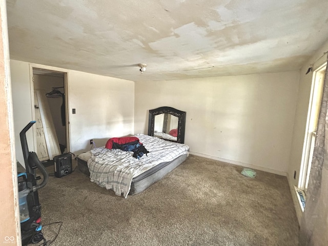 bedroom with carpet and baseboards
