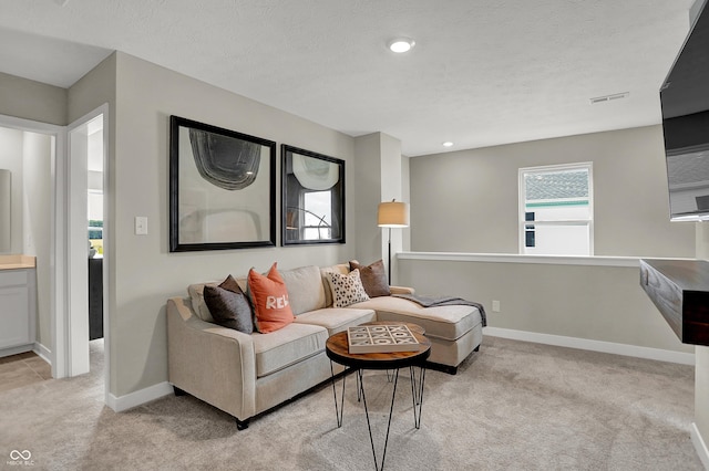 living room with light colored carpet, baseboards, and recessed lighting
