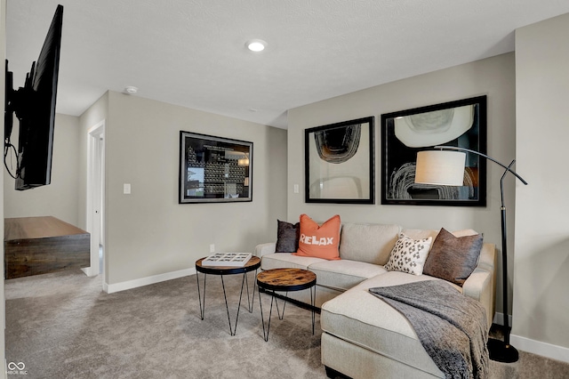 carpeted living room featuring baseboards