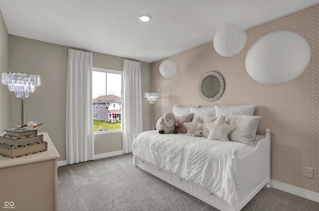 carpeted bedroom with baseboards