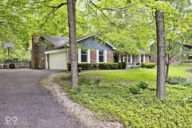 19446 Ethan Allen Ln, Westfield, IN 46074 - ranch-style house featuring brick siding, asphalt driveway, an attached garage, and a chimney