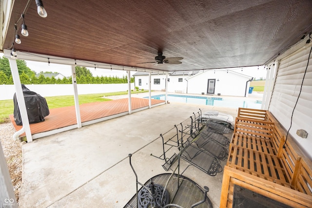 view of patio featuring fence, a ceiling fan, and a wooden deck