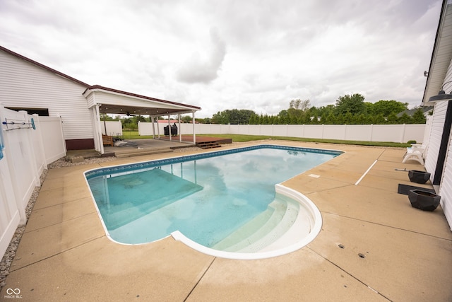view of pool with a patio and a fenced backyard