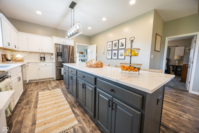 kitchen with stainless steel refrigerator with ice dispenser, white cabinets, a center island, dark wood finished floors, and dishwashing machine
