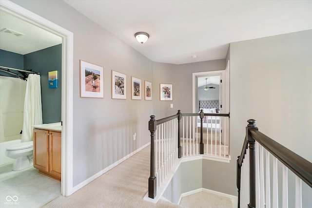 14130 Autumn Woods Dr, Carmel, IN 46074 - hall featuring an upstairs landing, baseboards, and light colored carpet
