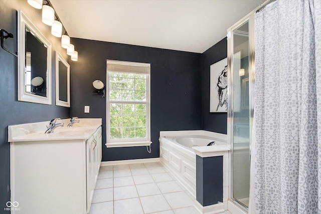 14130 Autumn Woods Dr, Carmel, IN 46074 - bathroom featuring tile patterned flooring, a shower stall, a garden tub, vanity, and baseboards