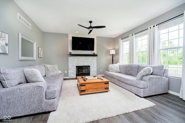 14130 Autumn Woods Dr, Carmel, IN 46074 - living area featuring a ceiling fan, baseboards, dark wood-style floors, a fireplace, and recessed lighting