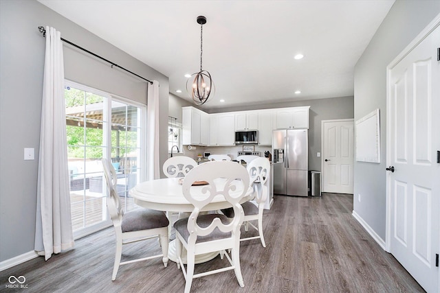 14130 Autumn Woods Dr, Carmel, IN 46074 - dining room featuring wood finished floors, a chandelier, baseboards, and recessed lighting