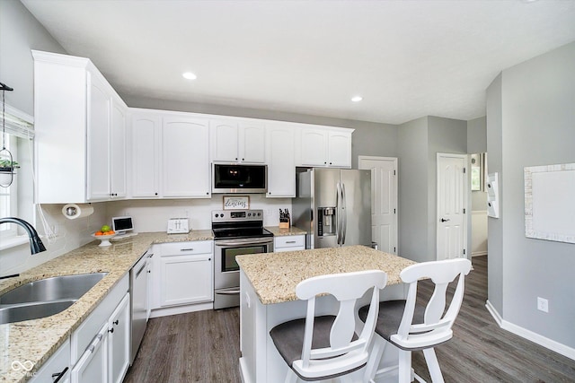 14130 Autumn Woods Dr, Carmel, IN 46074 - kitchen with stainless steel appliances, a sink, dark wood-style floors, a center island, and recessed lighting