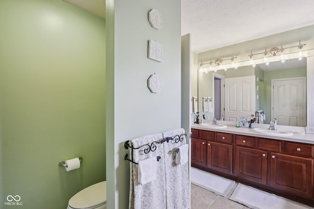 9311 Windrift Way, Zionsville, IN 46077 - full bath with double vanity, tile patterned floors, and a textured ceiling