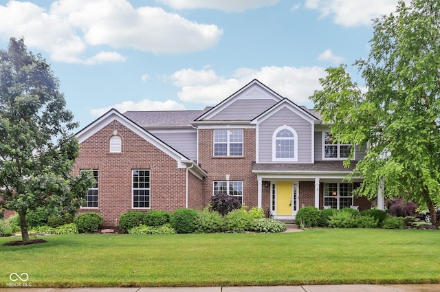 9311 Windrift Way, Zionsville, IN 46077 - traditional home with brick siding and a front yard