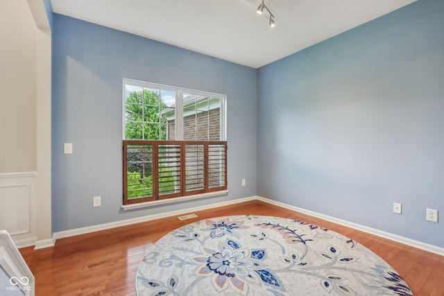 9311 Windrift Way, Zionsville, IN 46077 - bedroom with wood finished floors and track lighting