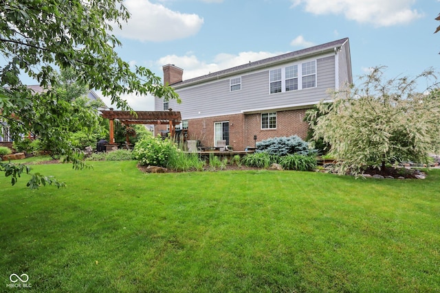 9311 Windrift Way, Zionsville, IN 46077 - back of property with a pergola, a chimney, brick siding, and a lawn