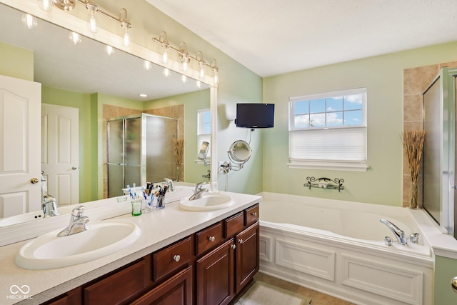 9311 Windrift Way, Zionsville, IN 46077 - bathroom featuring a stall shower, double vanity, a garden tub, and tile patterned flooring