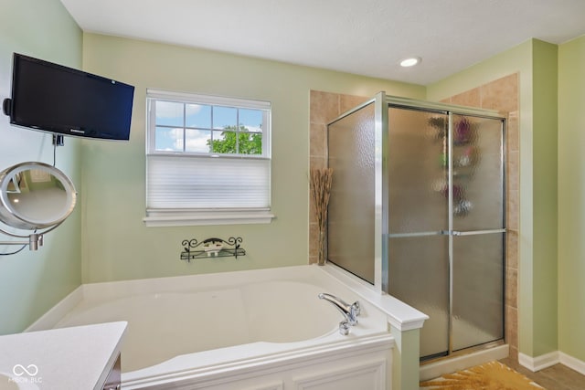 9311 Windrift Way, Zionsville, IN 46077 - full bath with a bath, a shower stall, vanity, and recessed lighting
