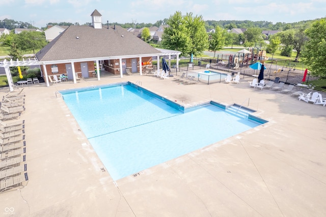 9311 Windrift Way, Zionsville, IN 46077 - community pool with a pergola and a patio area