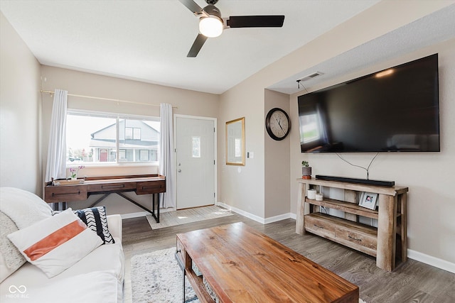 2230 Pleasant St, Indianapolis, IN 46203 - living area with wood finished floors, a ceiling fan, and baseboards