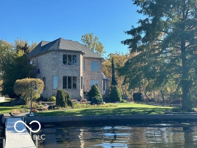 125 Ems B20C Ln, Pierceton, IN 46562 - view of side of home featuring a lawn