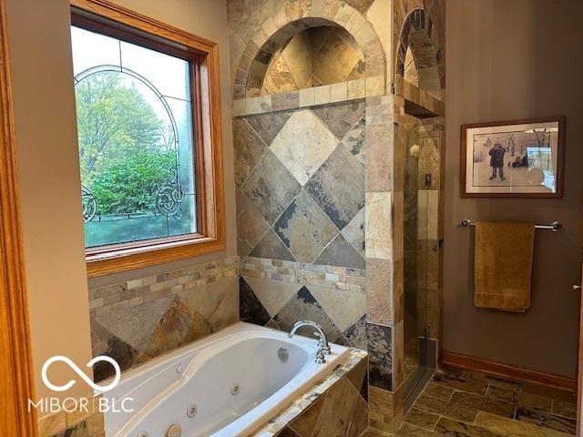 125 Ems B20C Ln, Pierceton, IN 46562 - full bathroom with a stall shower, a tub with jets, and baseboards