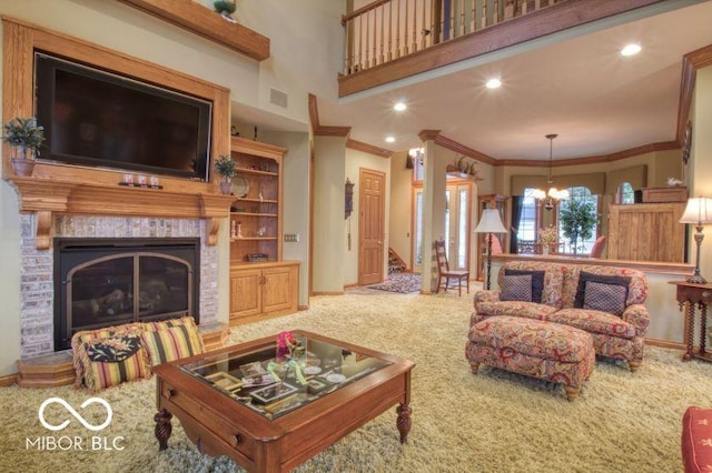 125 Ems B20C Ln, Pierceton, IN 46562 - carpeted living room with baseboards, ornamental molding, a fireplace, a chandelier, and recessed lighting