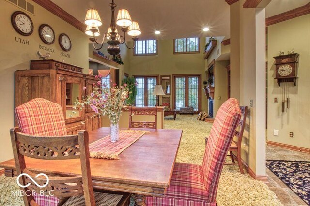 125 Ems B20C Ln, Pierceton, IN 46562 - dining space with a chandelier, light carpet, baseboards, ornamental molding, and recessed lighting