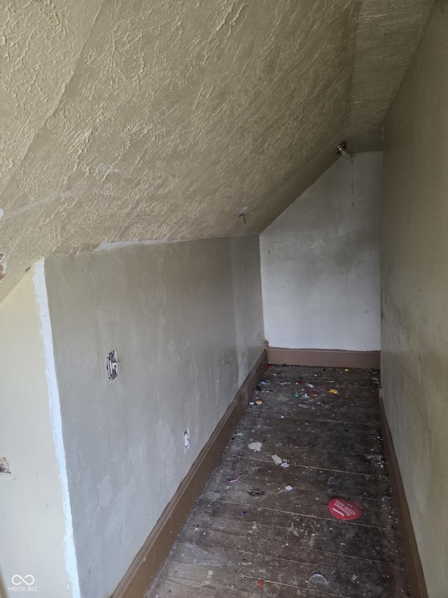 1331 S 14th St, New Castle, IN 47362 - bonus room featuring vaulted ceiling, a textured ceiling, hardwood / wood-style flooring, and baseboards