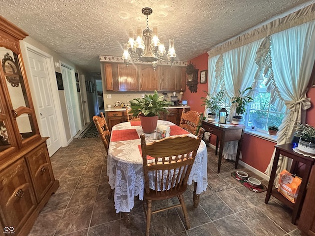 4533 N Willow Grove Rd, Brownsville, IN 47325 - dining area featuring a chandelier, baseboards, and a textured ceiling