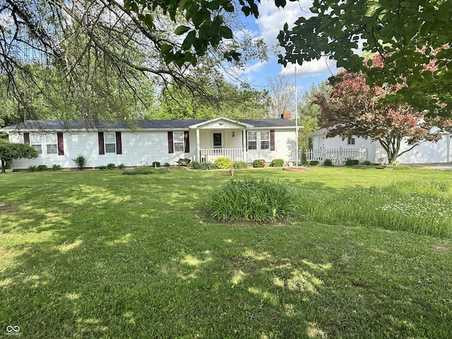 4533 N Willow Grove Rd, Brownsville, IN 47325 - single story home with a chimney, a porch, and a front lawn