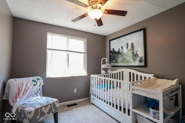 5522 Closser Ct, Indianapolis, IN 46221 - bedroom featuring carpet, a textured ceiling, and ceiling fan