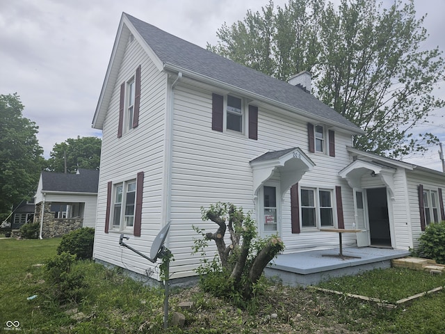 208 S Madison St, Converse, IN 46919 - view of side of home with a shingled roof
