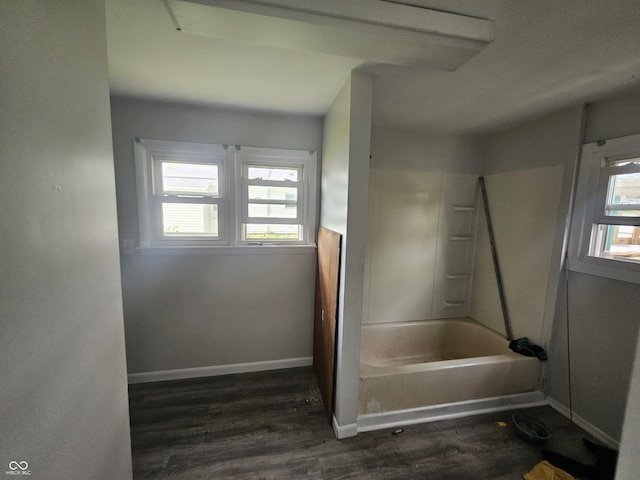 208 S Madison St, Converse, IN 46919 - bathroom featuring wood finished floors, a tub, and baseboards