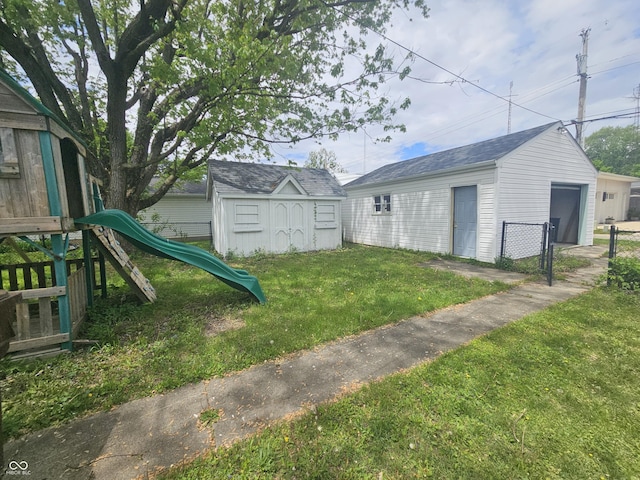 208 S Madison St, Converse, IN 46919 - view of yard featuring a playground, an outdoor structure, and a detached garage