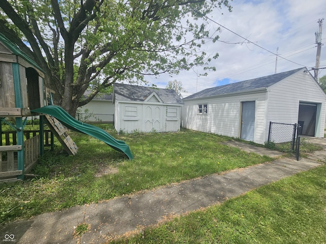 208 S Madison St, Converse, IN 46919 - view of yard featuring a playground and an outbuilding