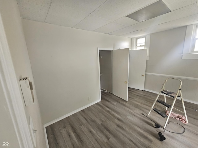 208 S Madison St, Converse, IN 46919 - workout room with a paneled ceiling, wood finished floors, and baseboards