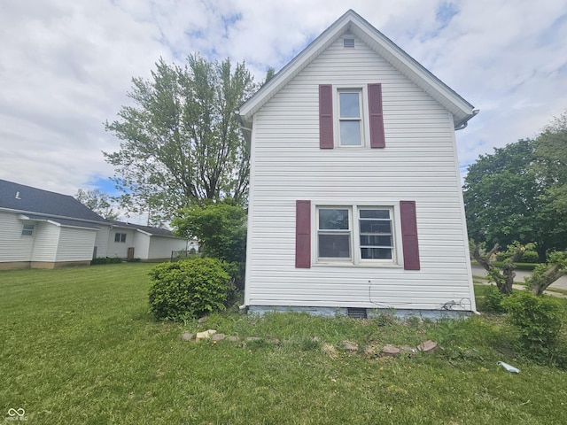 208 S Madison St, Converse, IN 46919 - view of property exterior featuring a lawn