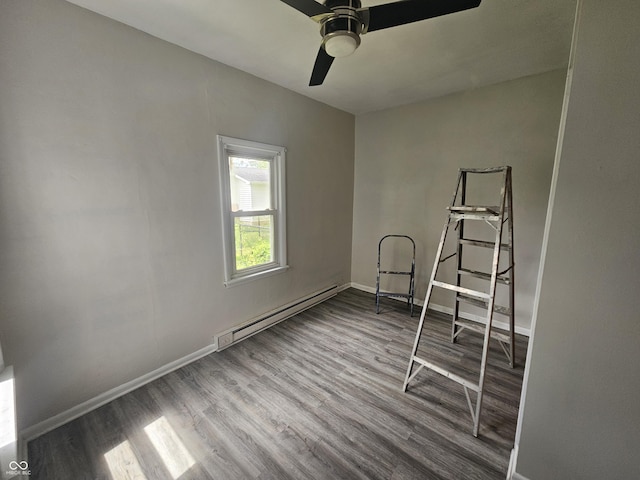 208 S Madison St, Converse, IN 46919 - empty room featuring a baseboard heating unit, wood finished floors, baseboards, and ceiling fan