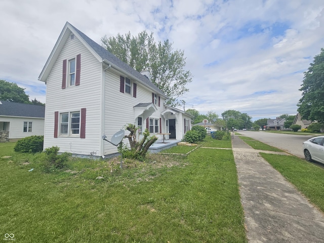 208 S Madison St, Converse, IN 46919 - view of side of property featuring a yard, a chimney, and driveway