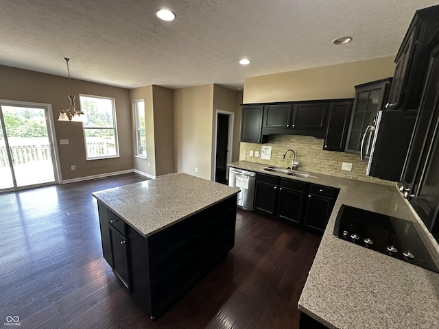 14462 Brook Meadow Dr, Mccordsville, IN 46055 - kitchen featuring a sink, dark cabinets, a textured ceiling, stainless steel dishwasher, and dark wood finished floors