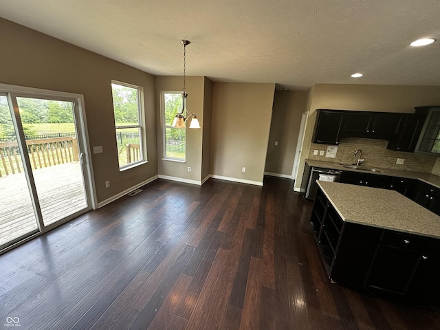 14462 Brook Meadow Dr, Mccordsville, IN 46055 - kitchen featuring dark cabinetry, a sink, dark wood-type flooring, backsplash, and recessed lighting
