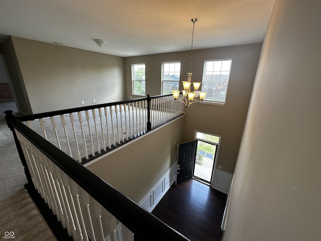 14462 Brook Meadow Dr, Mccordsville, IN 46055 - stairs with a chandelier, carpet floors, and a wainscoted wall