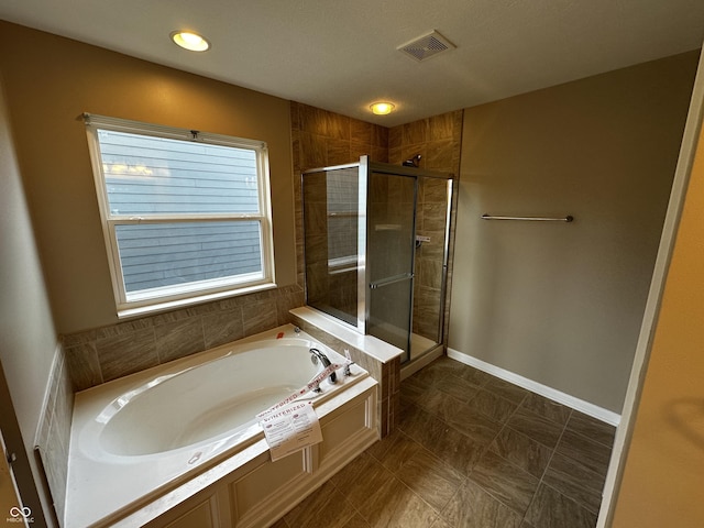 14462 Brook Meadow Dr, Mccordsville, IN 46055 - full bath featuring a garden tub, a stall shower, and baseboards